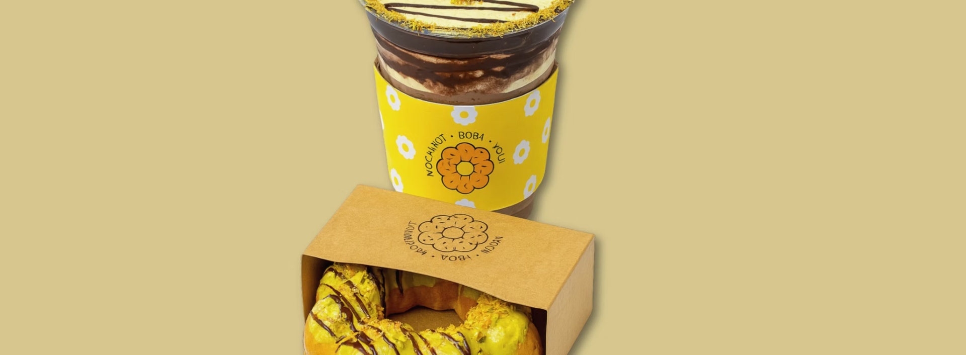 Matcha donut with branded packaging and drink